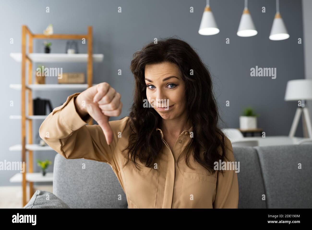 Woman Portrait Showing Dislike Thumbs Down Negative Feedback Stock Photo