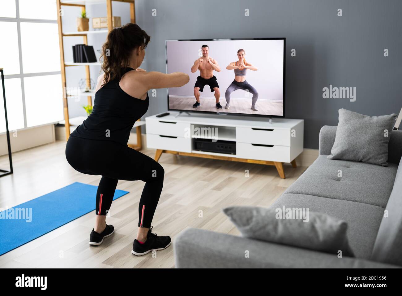 Online TV Home Fitness Workout And Exercise Stock Photo