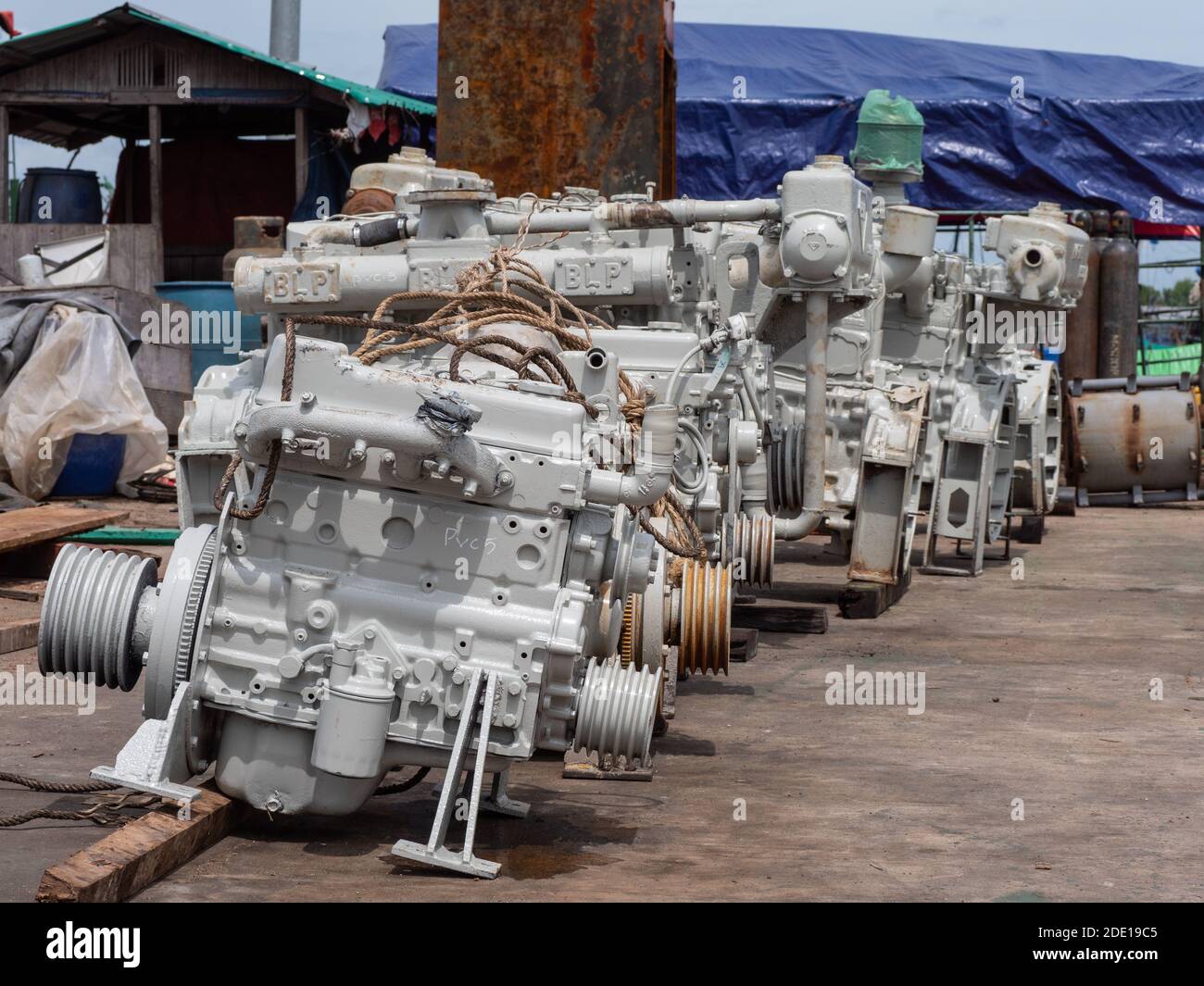 Old, used marine diesel engines at a quay in Myeik, Tanintharyi Region, Myanmar Stock Photo