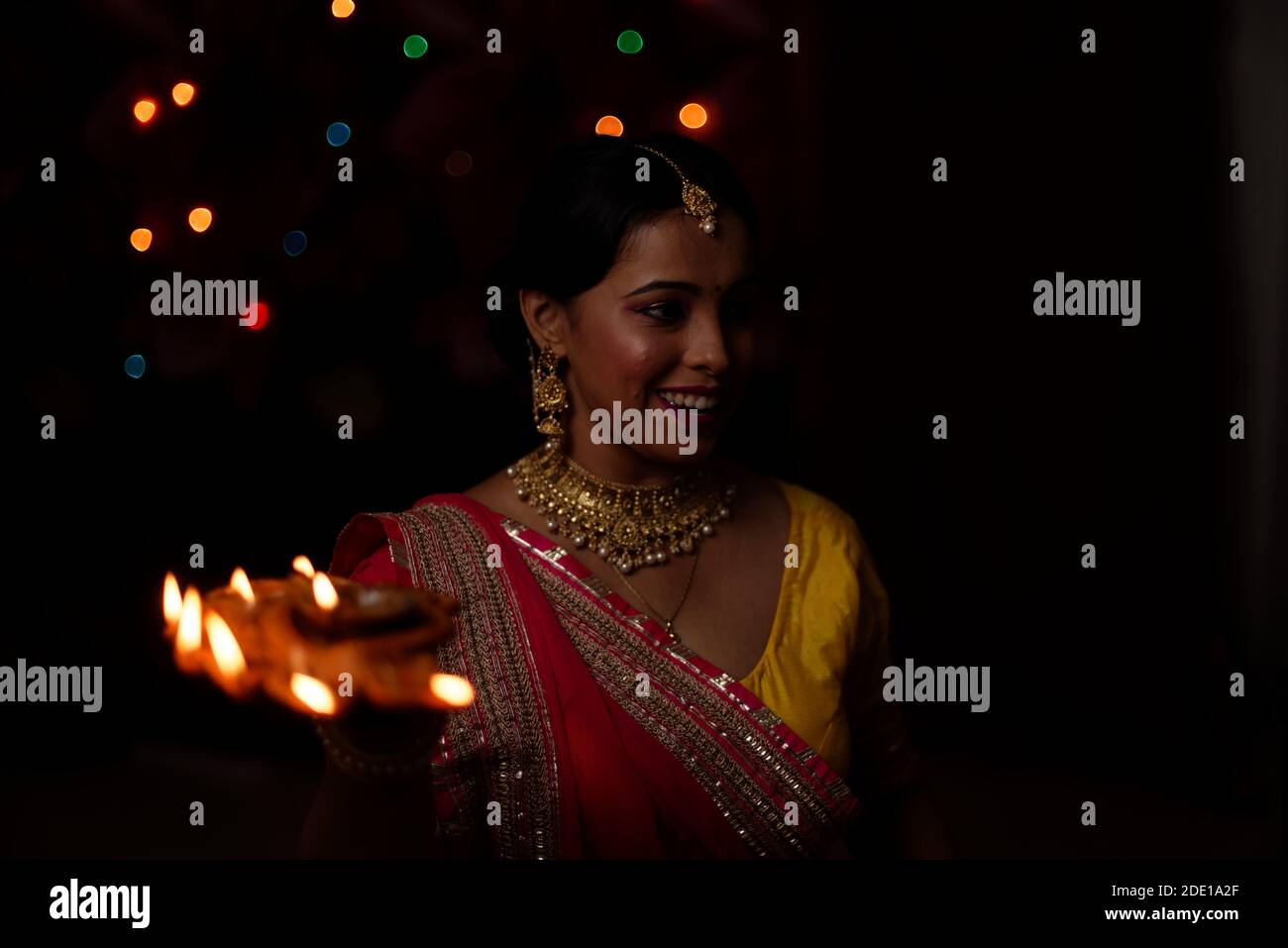 An young and beautiful Indian Bengali woman in Indian traditional dress