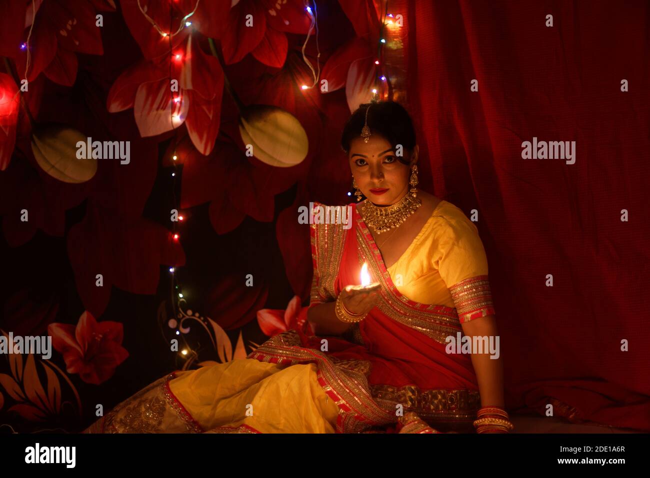 An young and beautiful Indian Bengali woman in Indian traditional dress