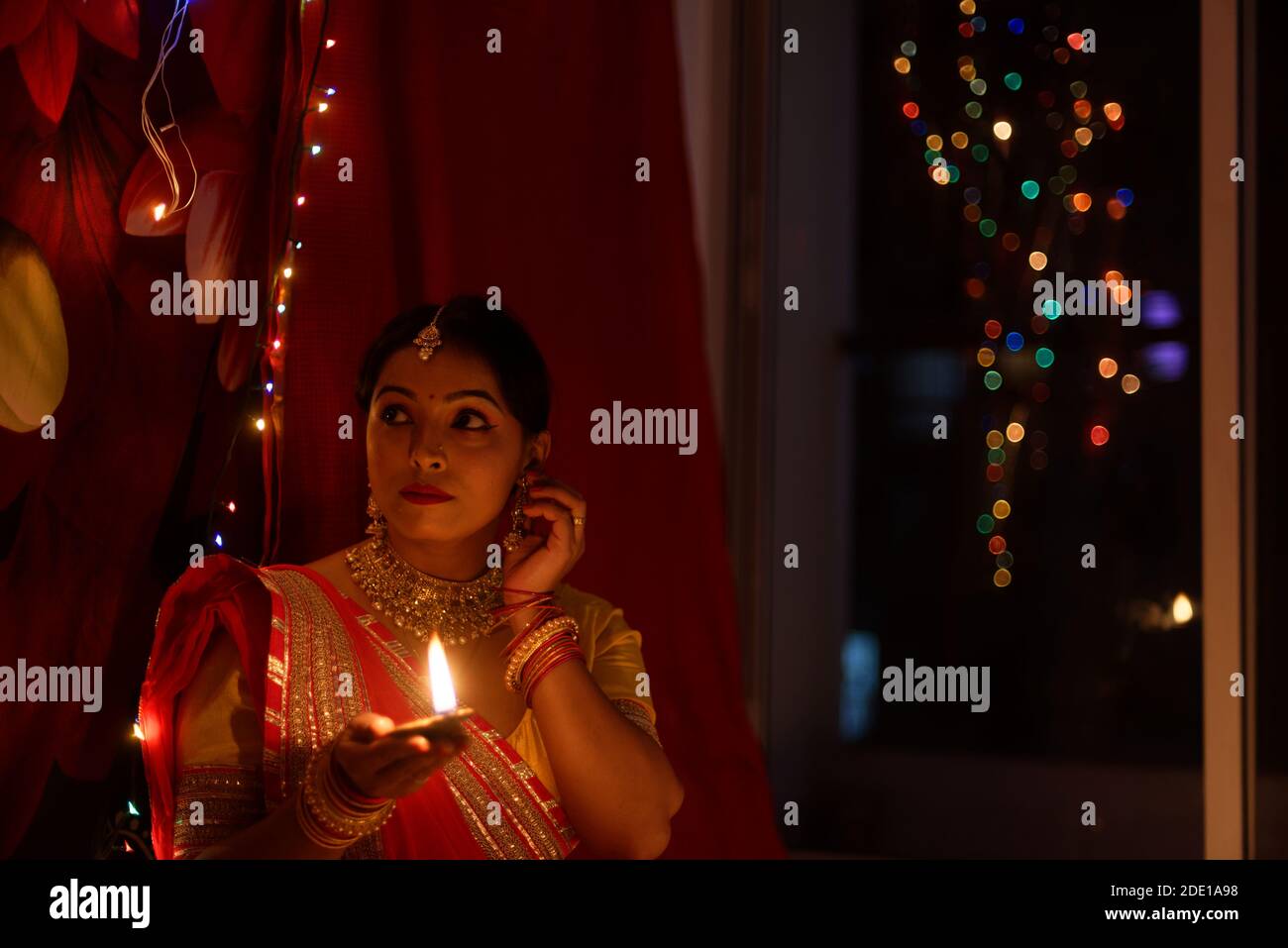 An young and beautiful Indian Bengali woman in Indian traditional dress