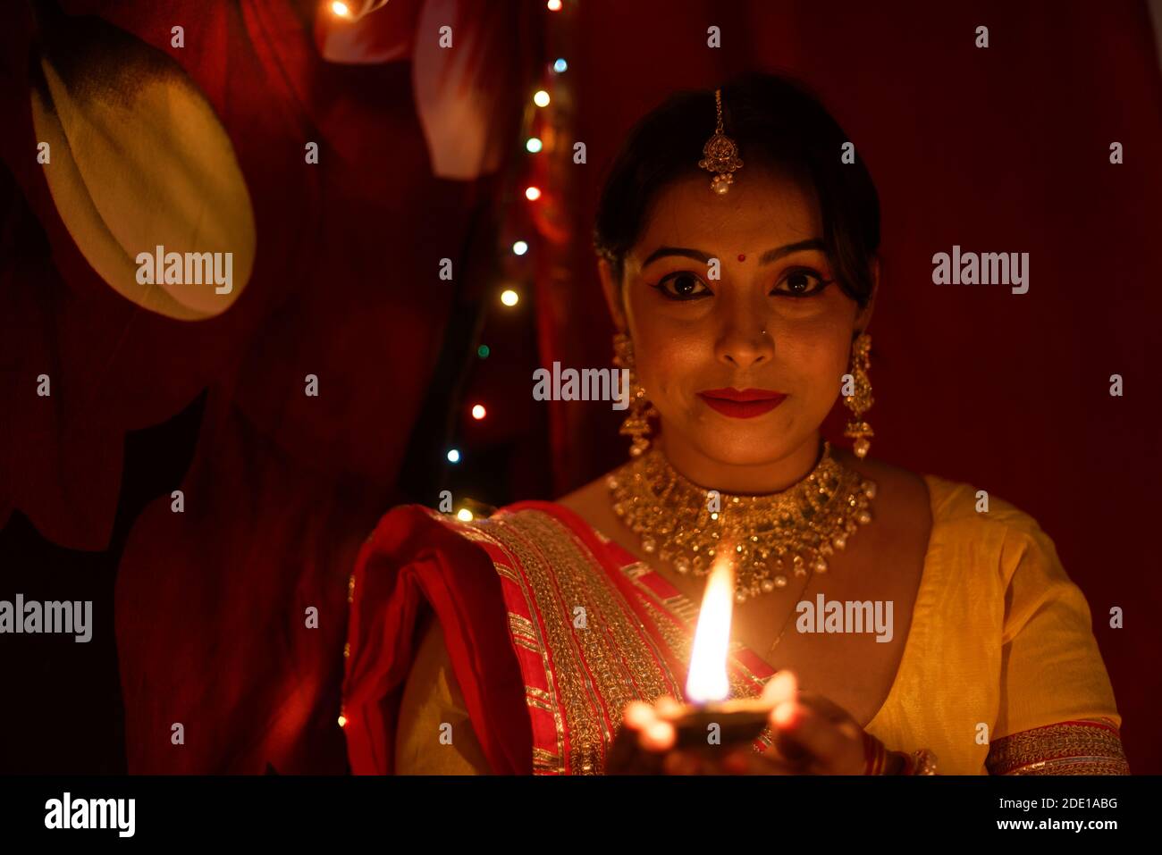 An young and beautiful Indian Bengali woman in Indian traditional dress