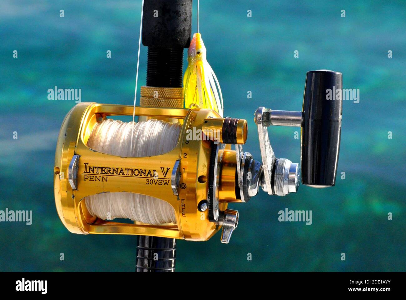 Negril, Jamaica - May 4, 2015 - International V Penn gold color fishing reel for deepsea fishing Stock Photo
