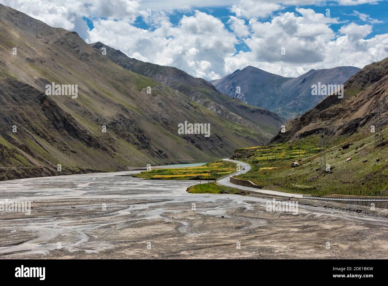 Barley field and glacial river in the mountain, Gyantse County, Tibet, China Stock Photo