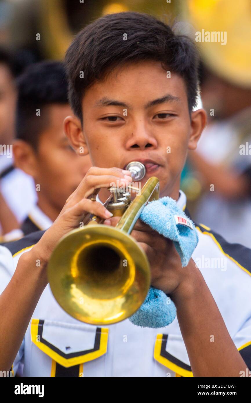 A Filipino marching band trumpeter during the May Flower Tapusan Festival in Alitagtag, Batangas, Philippines Stock Photo