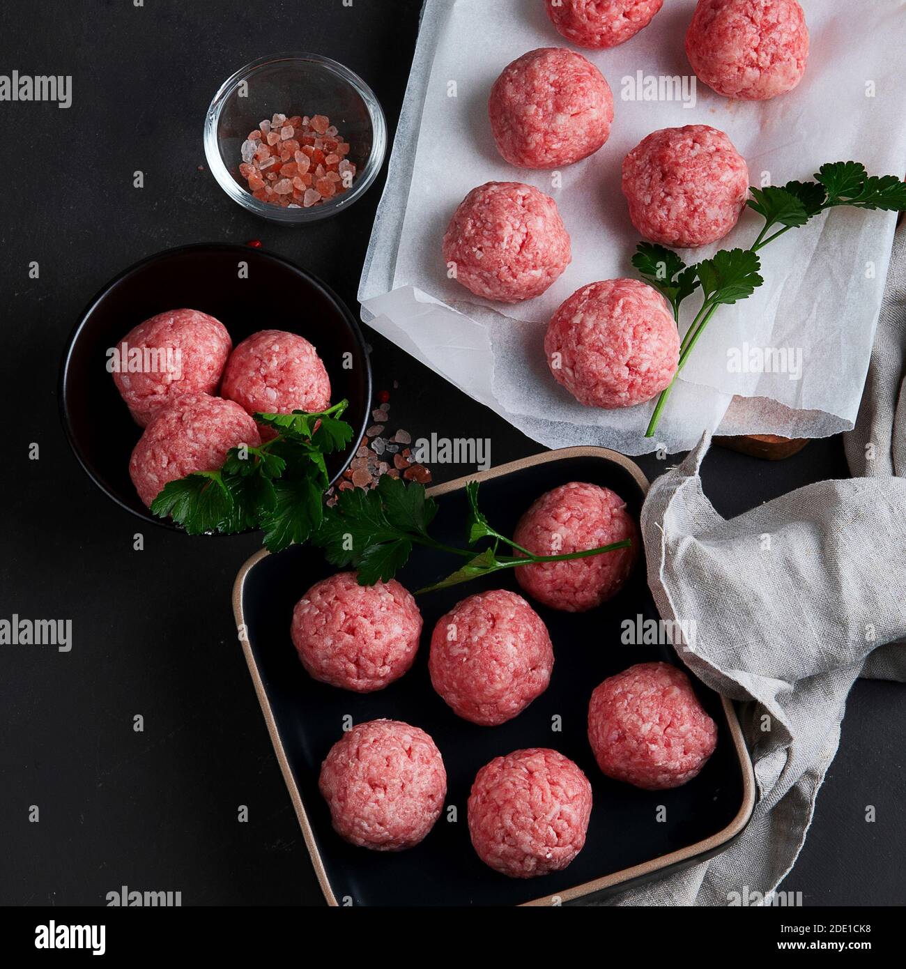 Fresh raw meatballs with herbs. Stock Photo