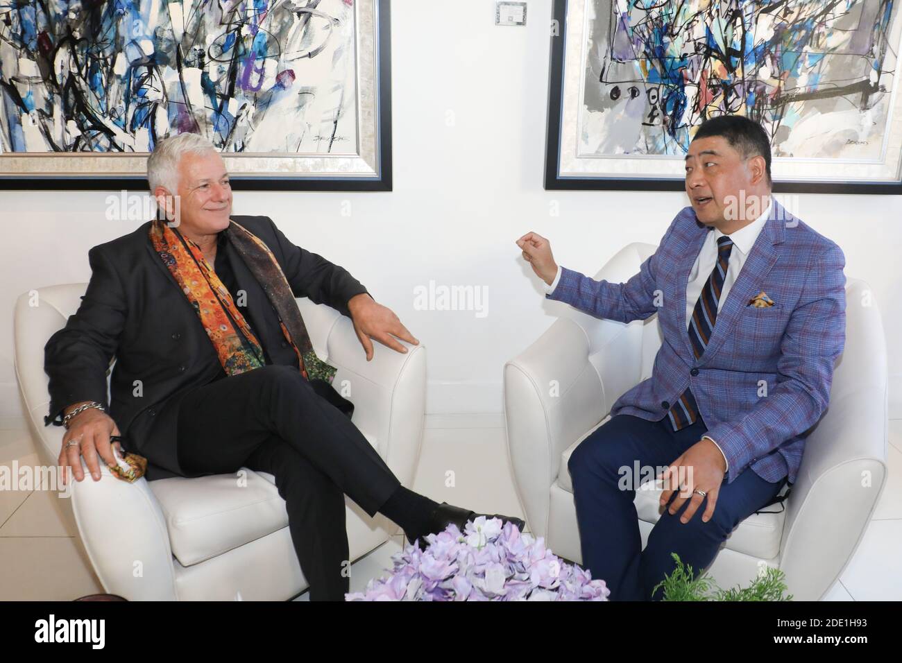 Beverly Hills, California.  27th November, 2020.  Art consultant /curator Michael Sean Degnan is interviewed by TV Host Joey Zhou for the Zhou Zheng Art Channel show at the Winn Slavin Fine Art Gallery in Beverly Hills, California.  Degnan is the Senior Art Advisor and Media Marketing Director for the Winn Slavin Fine Art Gallery,  Ambassador at Mondial Art Academia, and art consultant/curator in the fine art industry.  Joey Zhou is the host of the Zhou Zheng Art Channel and founder of the Los Angeles Beverly Arts (LABA) and The Beverly News. Credit:  Sheri Determan Stock Photo