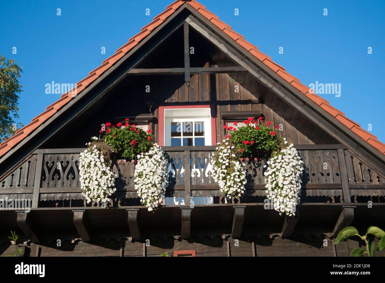 old house with a wooden balcony, with blue sky background Stock Photo ...