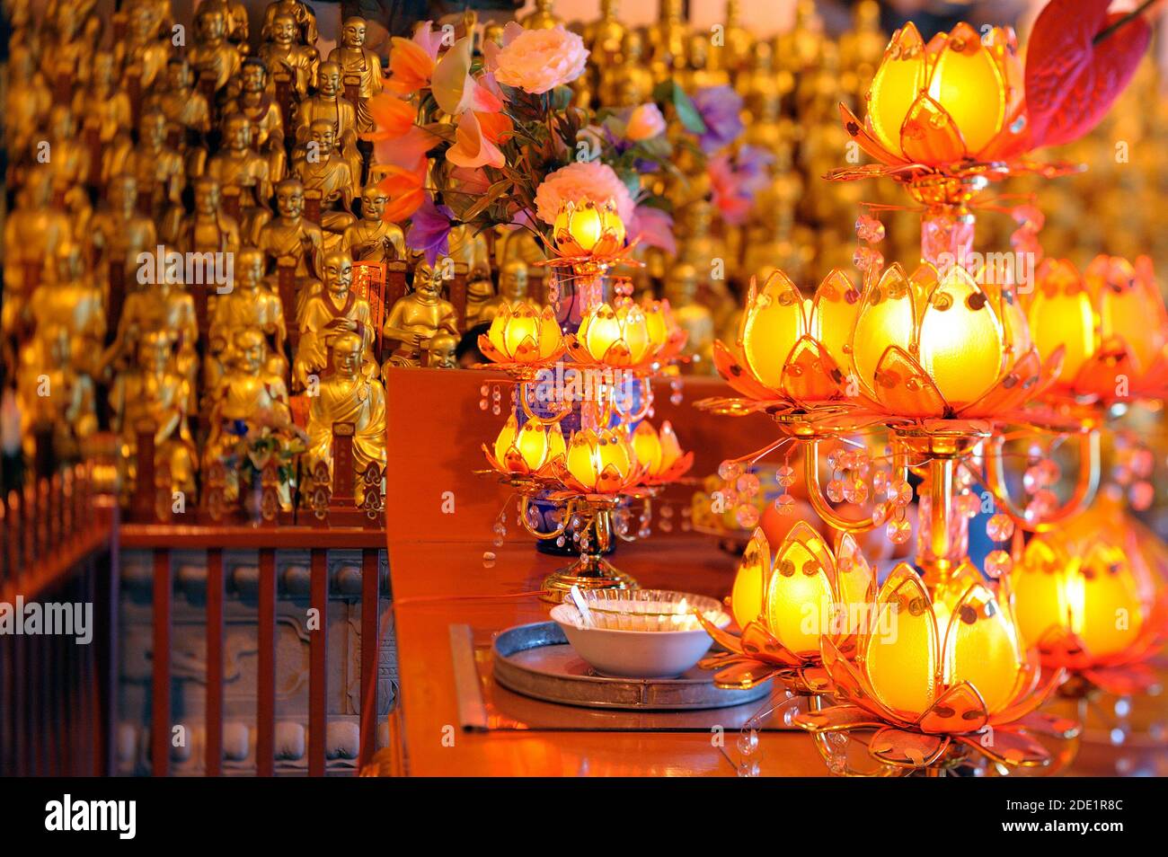 Golden statues of 500 Longhans and offerings in Longhua Buddhist temple. Stock Photo