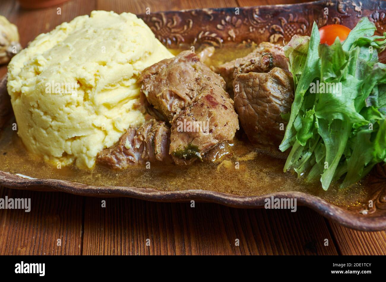 Fungee and Pepperpot - national dish of Antigua and Barbuda, spicy meat soup Stock Photo