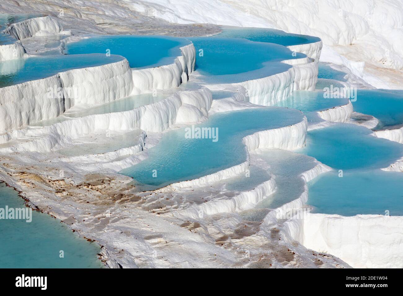 Pamukkale, Denizli Province, Turkey.  The white travertine limestone terraces and pools.  Pamukkale is known as the Cotton Castle.  It is a UNESCO Wor Stock Photo