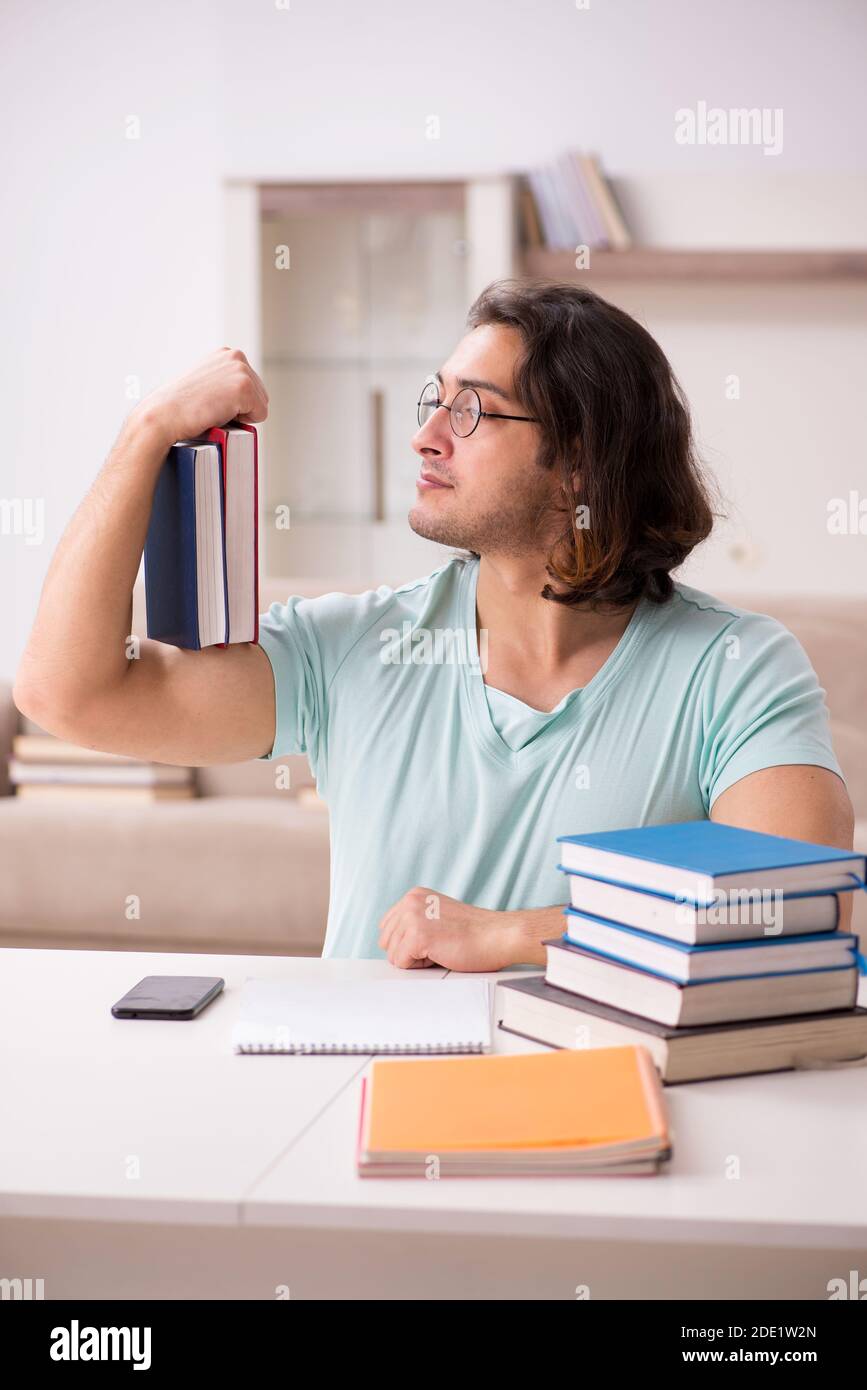 Young student preparing for exams at home Stock Photo - Alamy