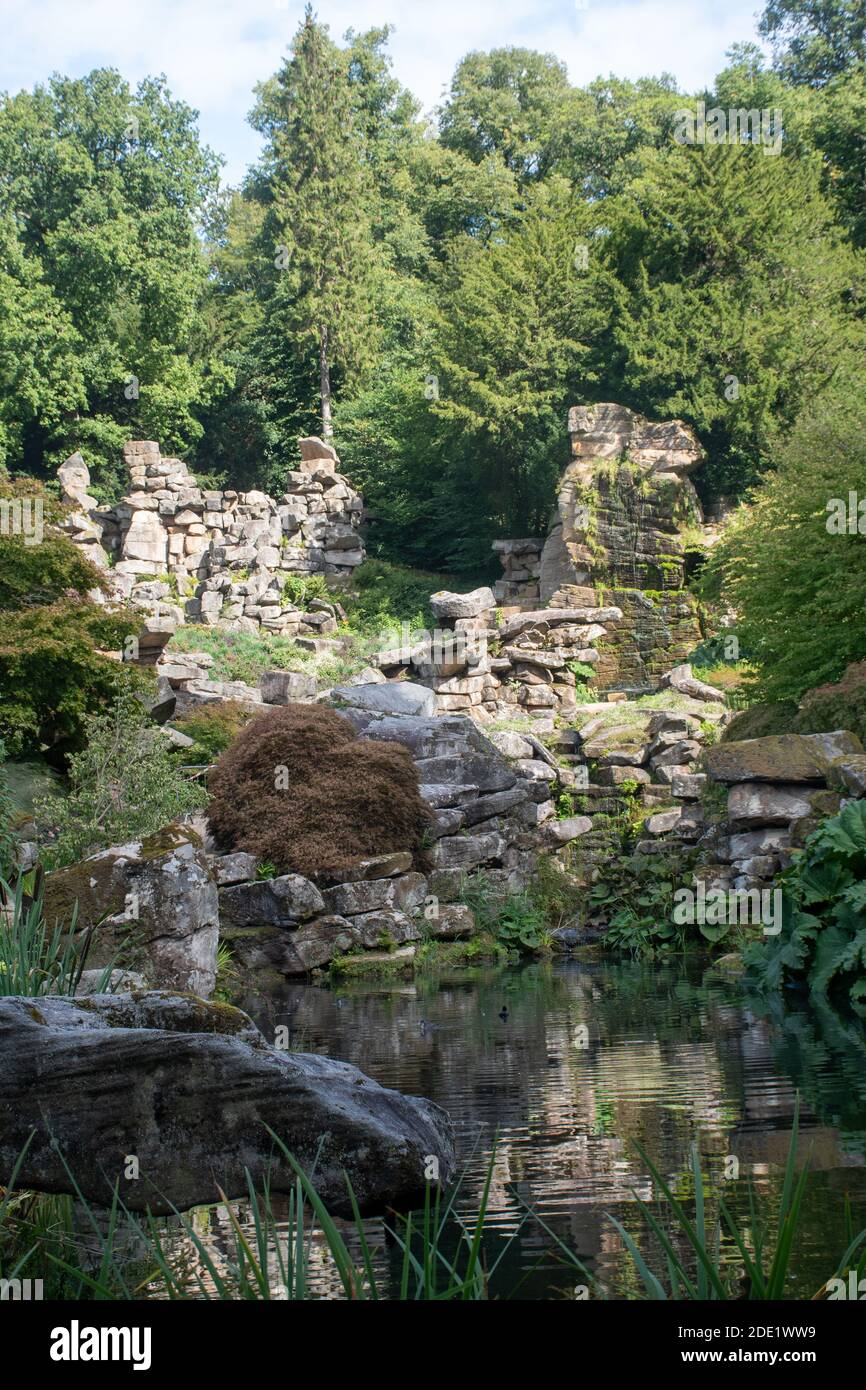 Rocks and pool in landscaped garden Stock Photo
