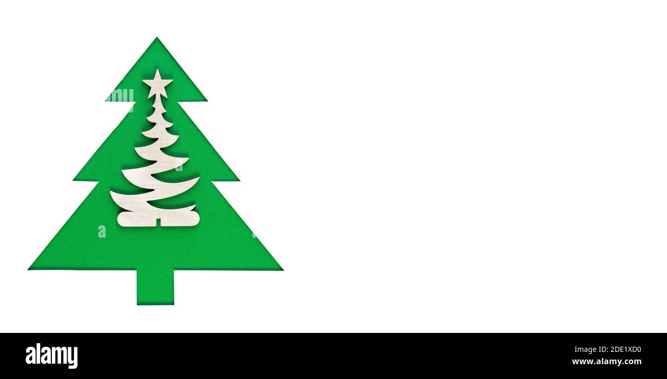 Christmas tree cut out of paper on a white background. Silhouette of Green christmas tree