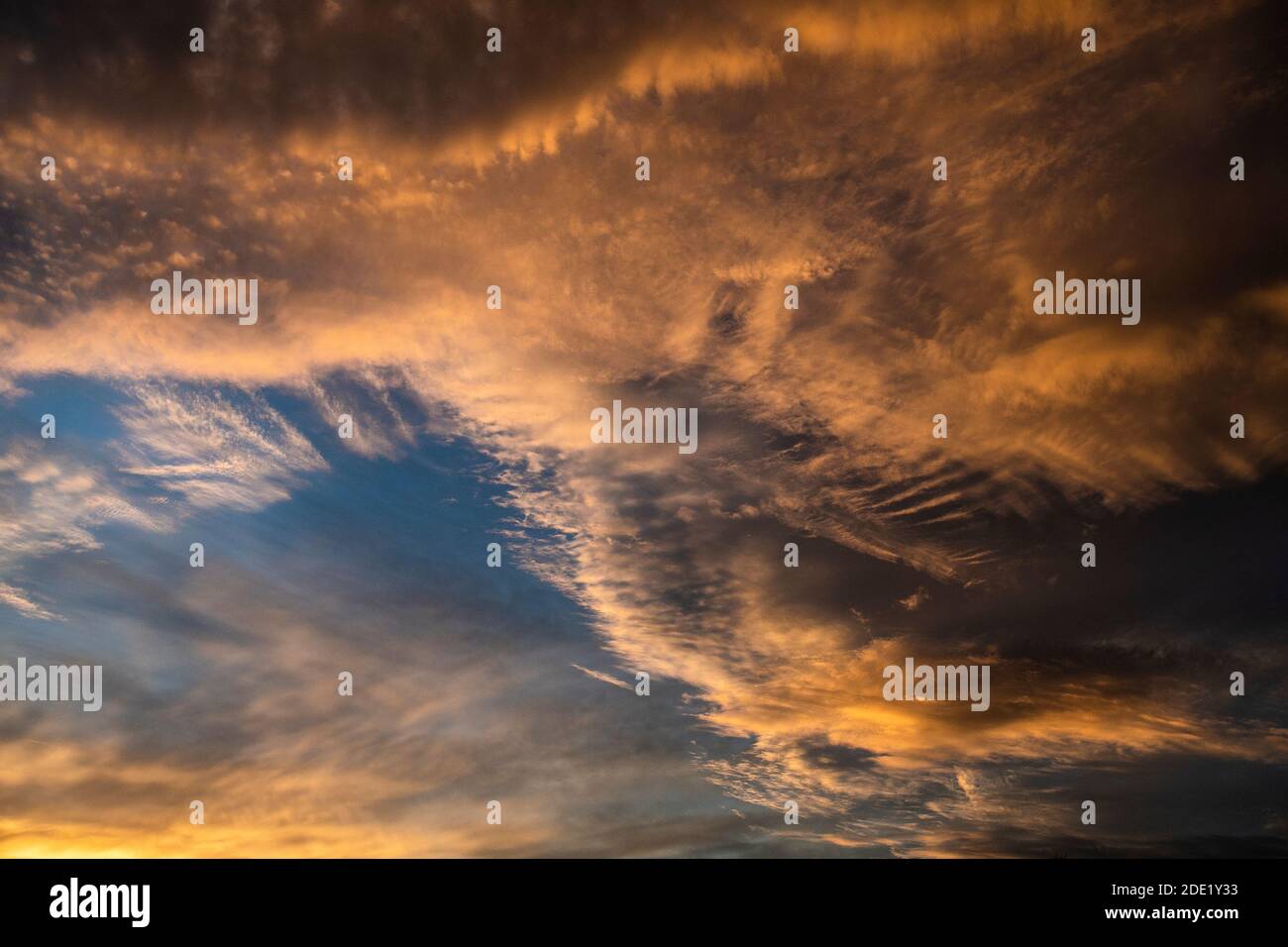 dramatic skies with sunlight and dark clouds Stock Photo