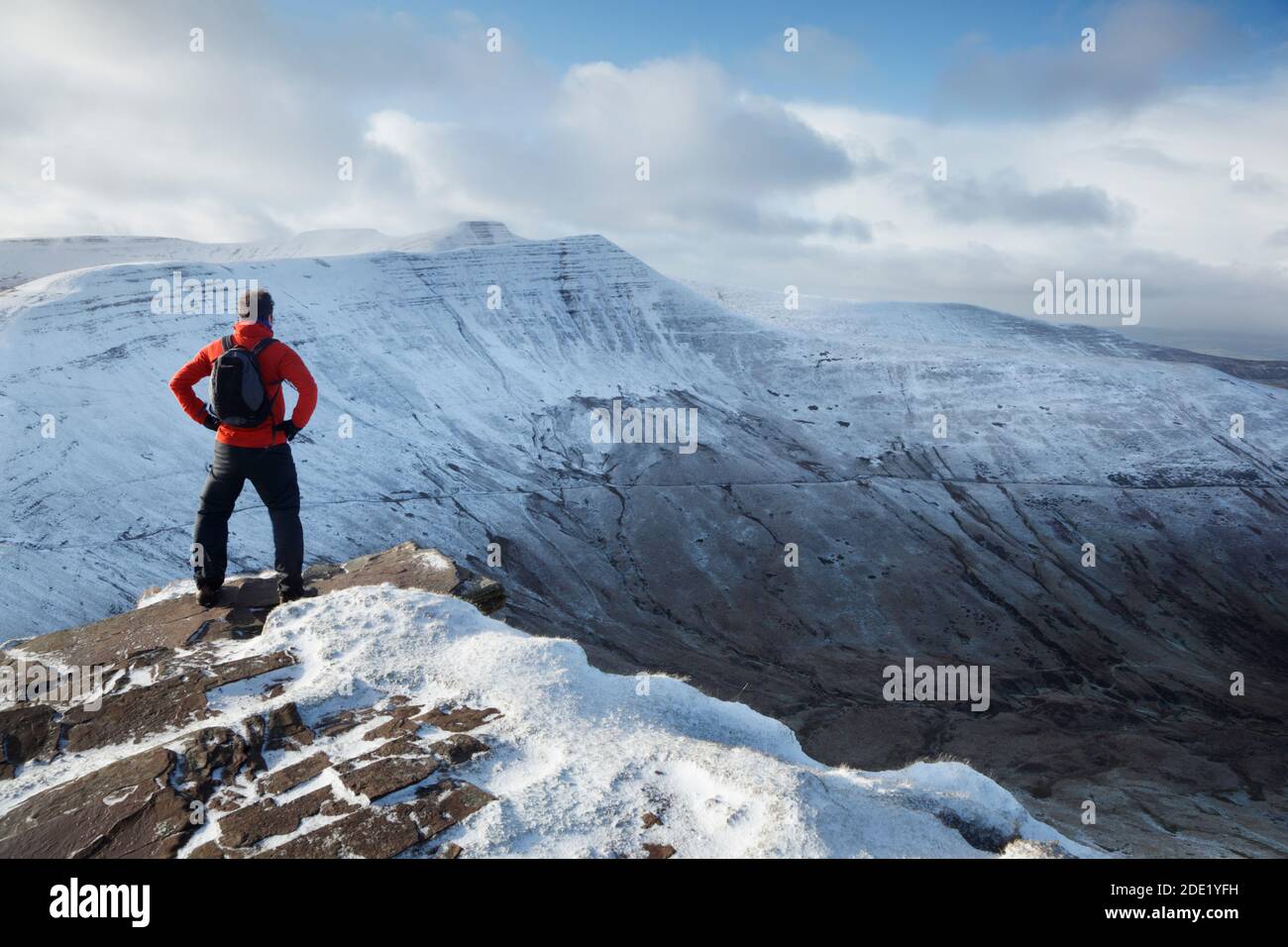 Hillwalker at the summit of Fan y Big. Brecon Beacons National Park. Wales. UK. Corn Du; Pen y Fan and Cribyn in the distance. Stock Photo