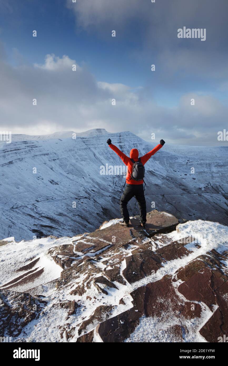 Hillwalker celebrating at the summit of Fan y Big. Brecon Beacons National Park. Wales. UK. Stock Photo