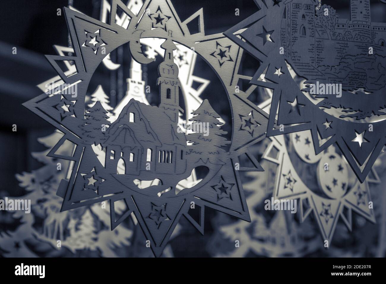 Black & white image of wooden Christmas decorations for sale in a Christmas market in Munich