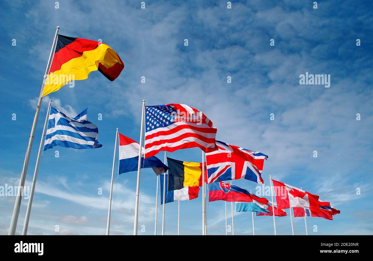 Flags of different nation floating in the wind Stock Photo