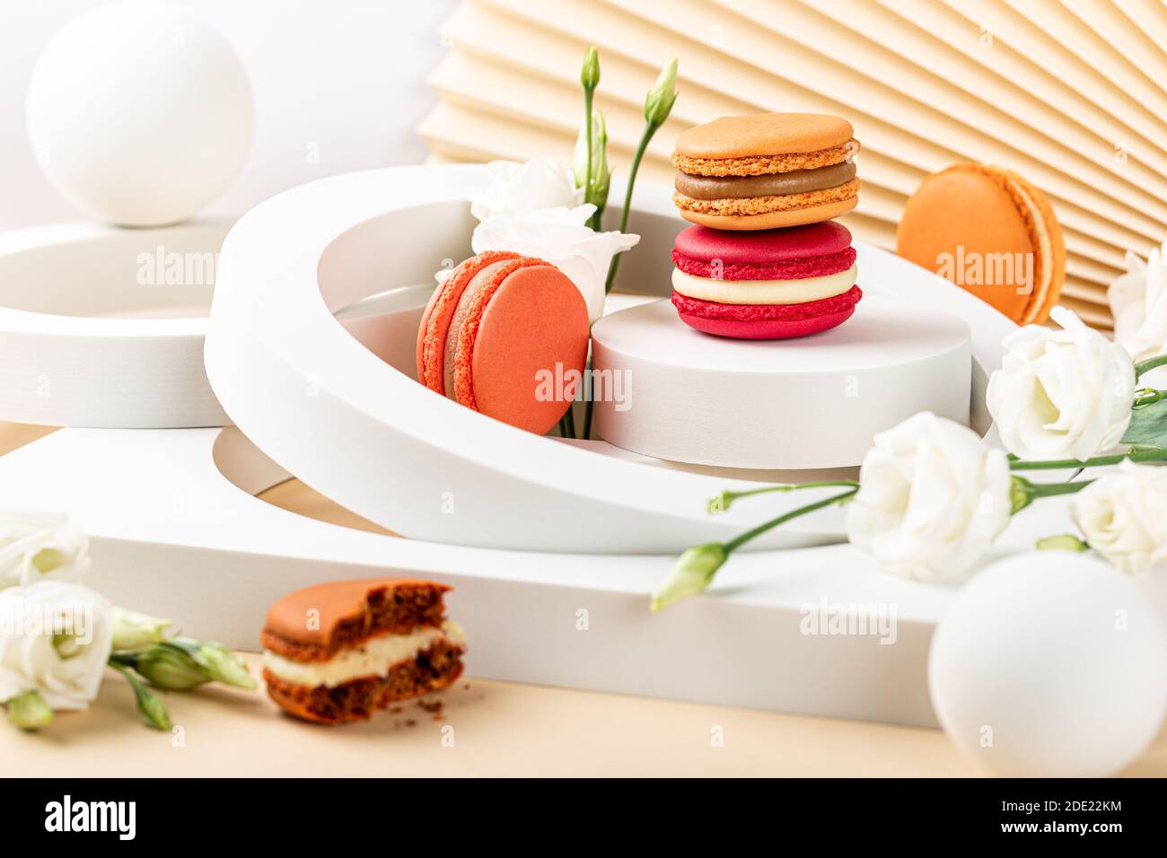 Cake macaron or macaroon on green background Stock Photo