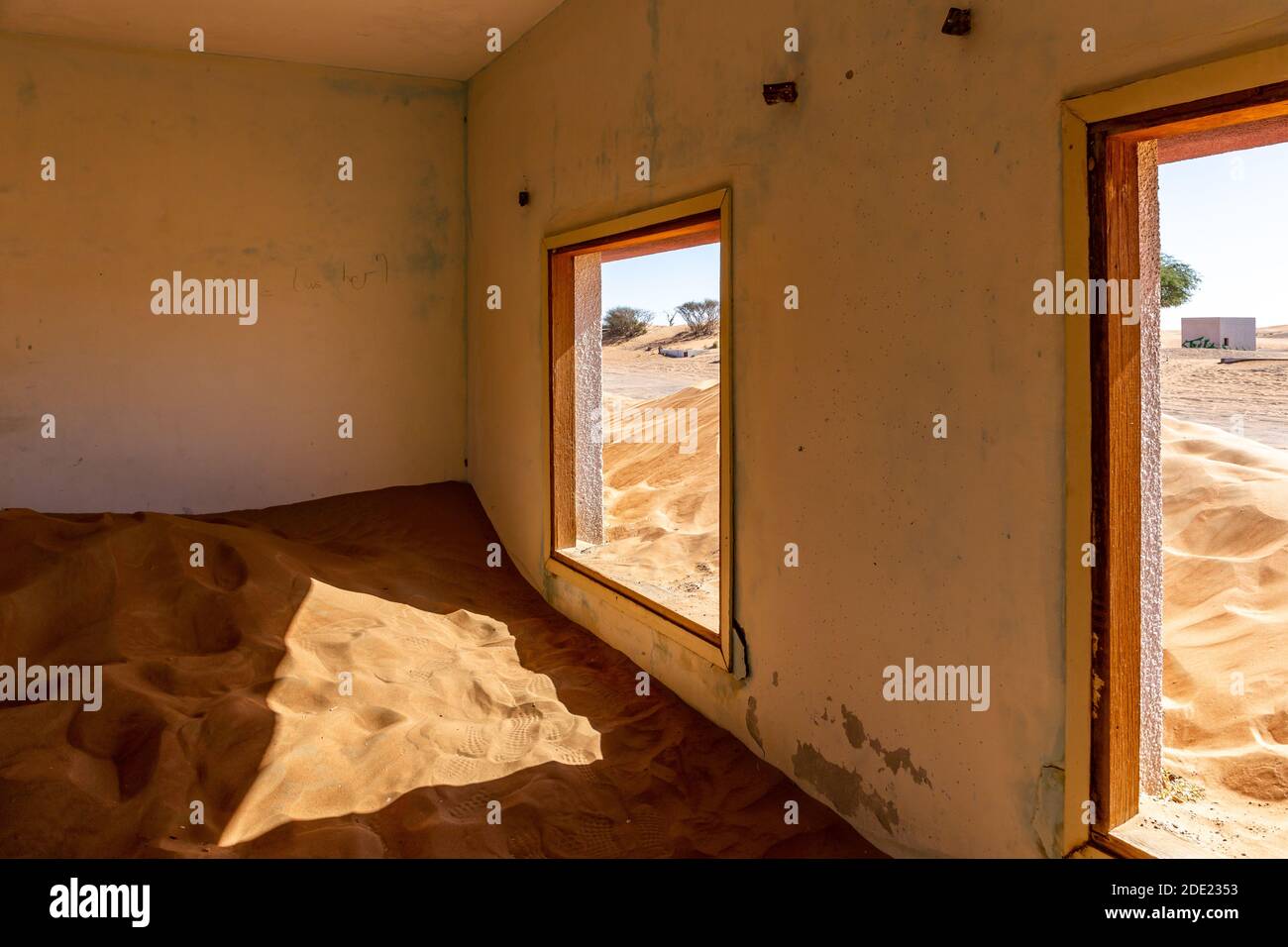 Neglected house interior buried in the sand in Al Madam ghost village