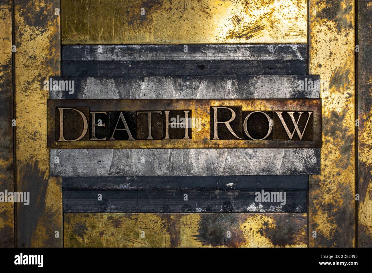 Death Row text on grunge lead with textured copper and gold background Stock Photo