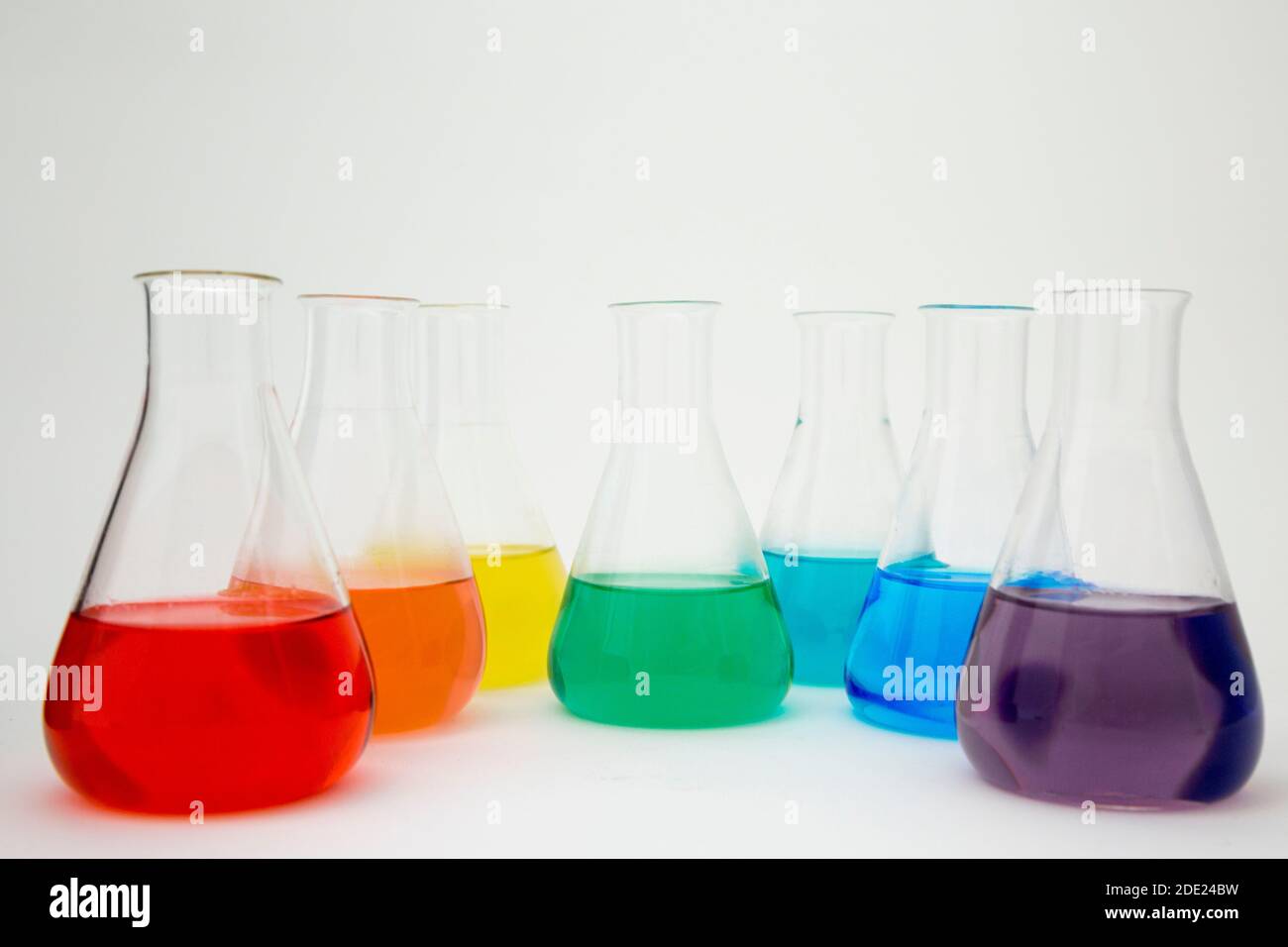 Scientific laboratory glass erlenmeyer flask filled with colorful ...