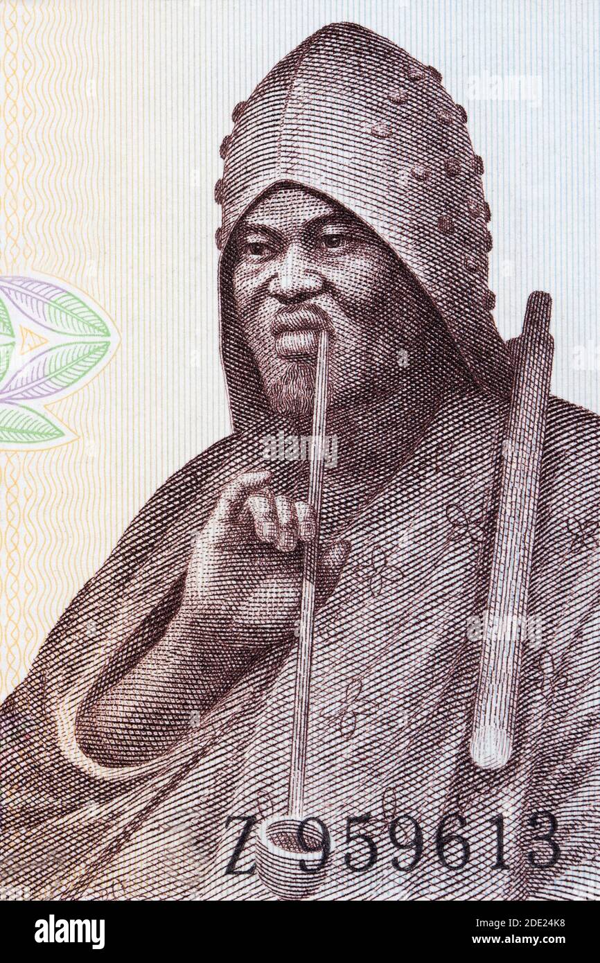 Man smoking a pipe a portrait from old Guinean money Stock Photo