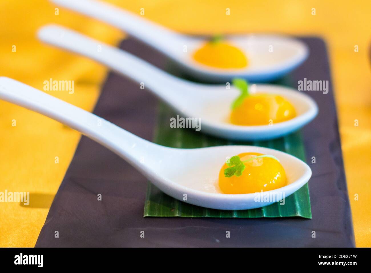 Yolk like dish at Mozai, a high end restaurant in Bali, Indonesia Stock Photo