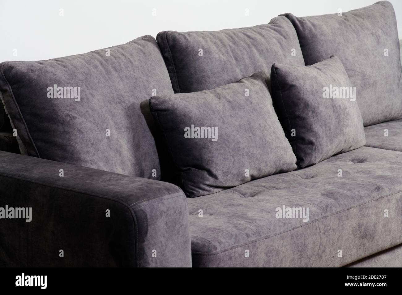 Soft pillows on grey sofa close up view isolated Stock Photo Alamy