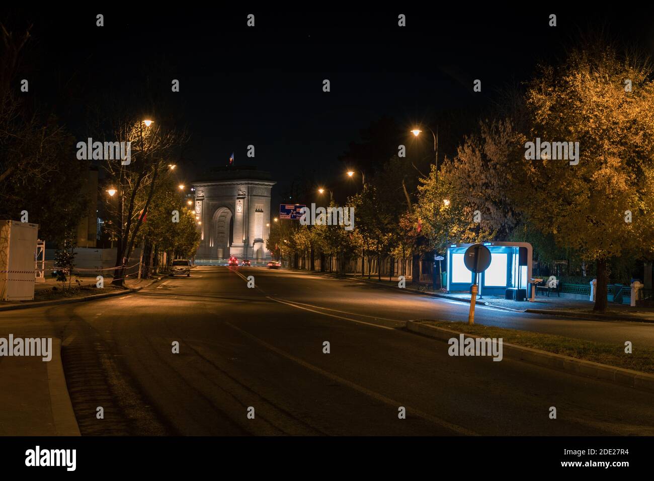Night view to the Arc de Triomphe, from Alexandru Constantinescu Street. Bucuresti, Romania, November 26, 2020 Stock Photo
