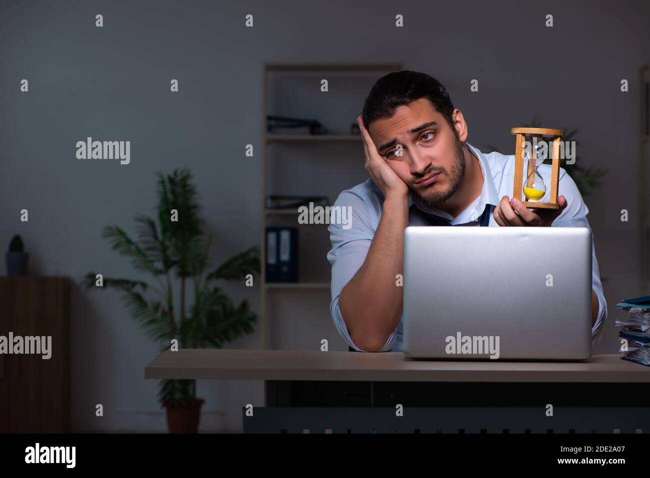 Young businessman working late in the office workplace Stock Photo - Alamy