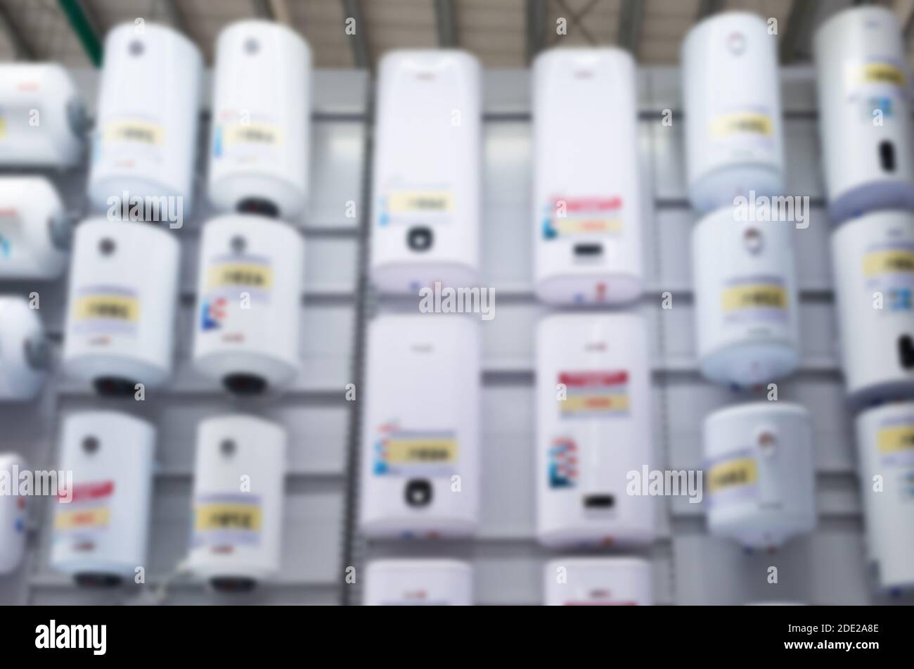 blurred and defocused: a large selection of electric water heaters in the house Stock Photo