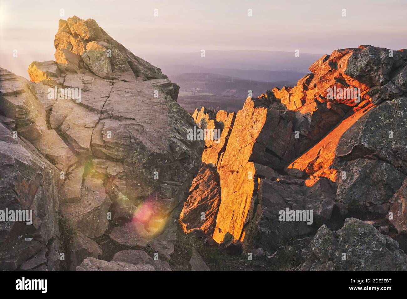 Beautiful sunset over boulders in the Harz mountains, Harz National Park, Lower Saxony, Germany. Stock Photo