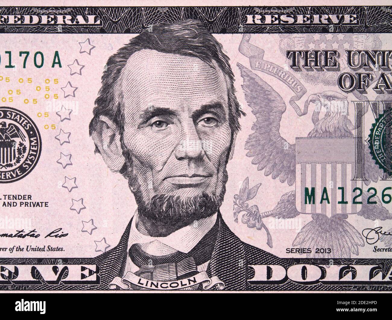 Abraham Abe Lincoln on USA five dollar bill close up, 5 usd, United States of America money closeup Stock Photo
