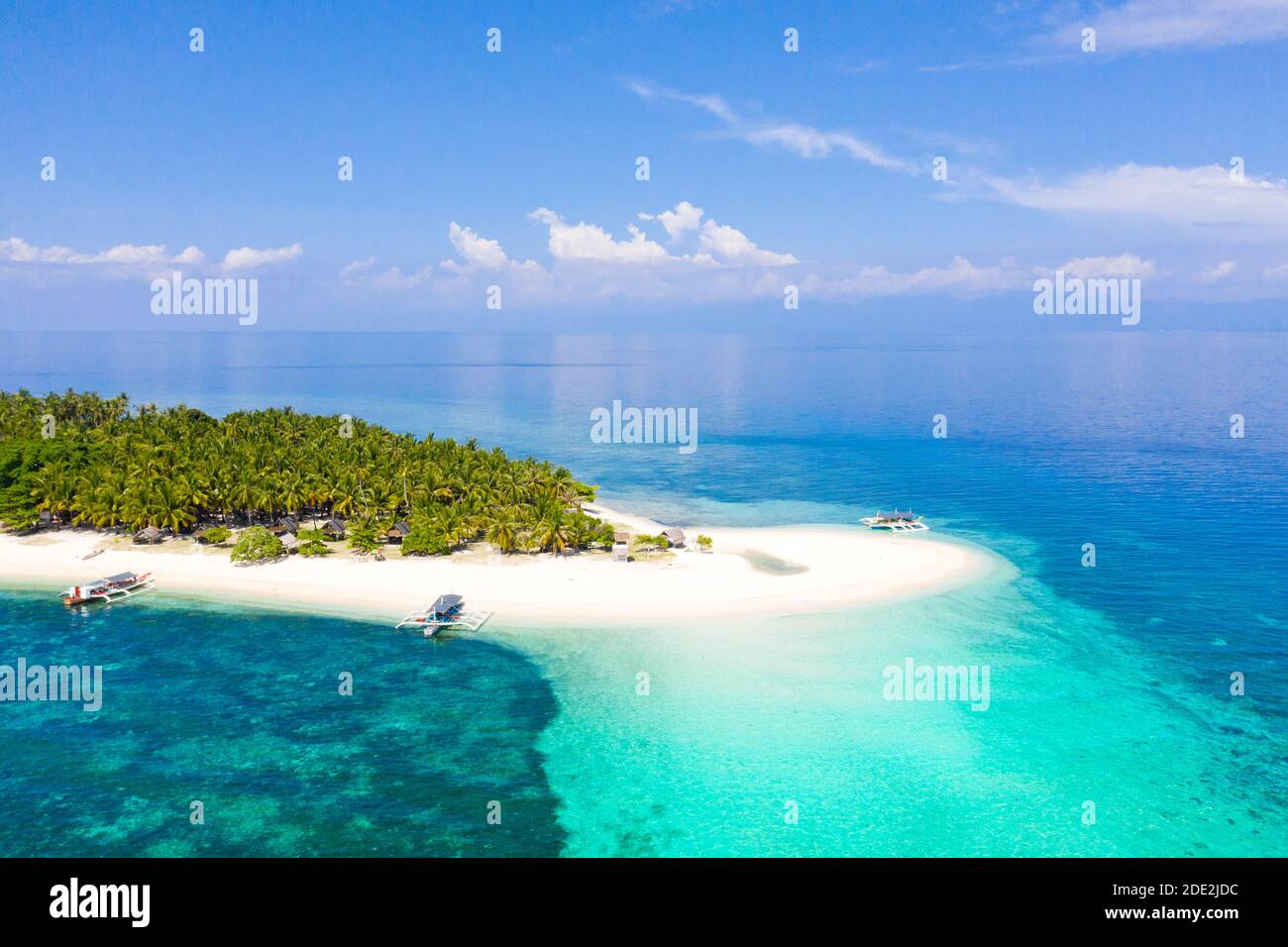 landscape of tropical island beach with perfect sky. Island with a tropical beach and turquoise lagoons. Digyo Island, Philippines. Stock Photo