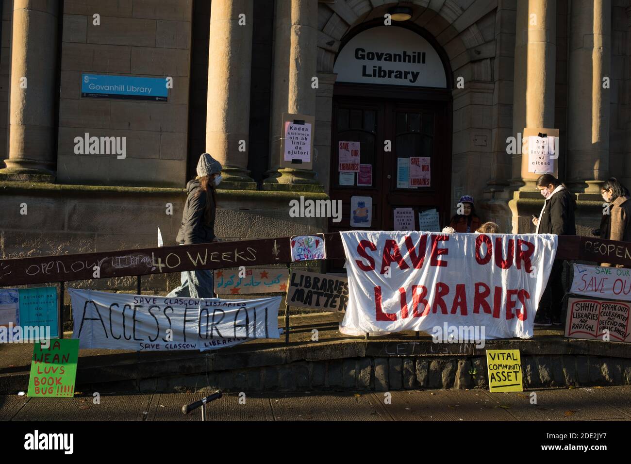 Glasgow, Scotland, UK, 28th November 2020. People campaign to re-open the Govanhill public library, in the Southside of the city, which have been closed now for 40-weeks. Campaigners maintain the libraries are needed for education, for the mental health benefits and for the wider needs of the city's most diverse local communities, during these unprecedented times of the Covid-19 global health pandemic. It is also feared the the city council will use the temporary closures as a way of keeping the libraries closed permanently. Approximately 20 libraries are currently closed within Glasgow. Photo Stock Photo