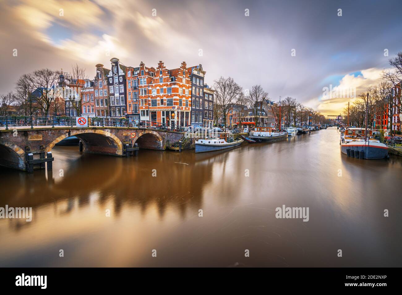 Amsterdam, Netherlands bridges and canals at twilight. Stock Photo