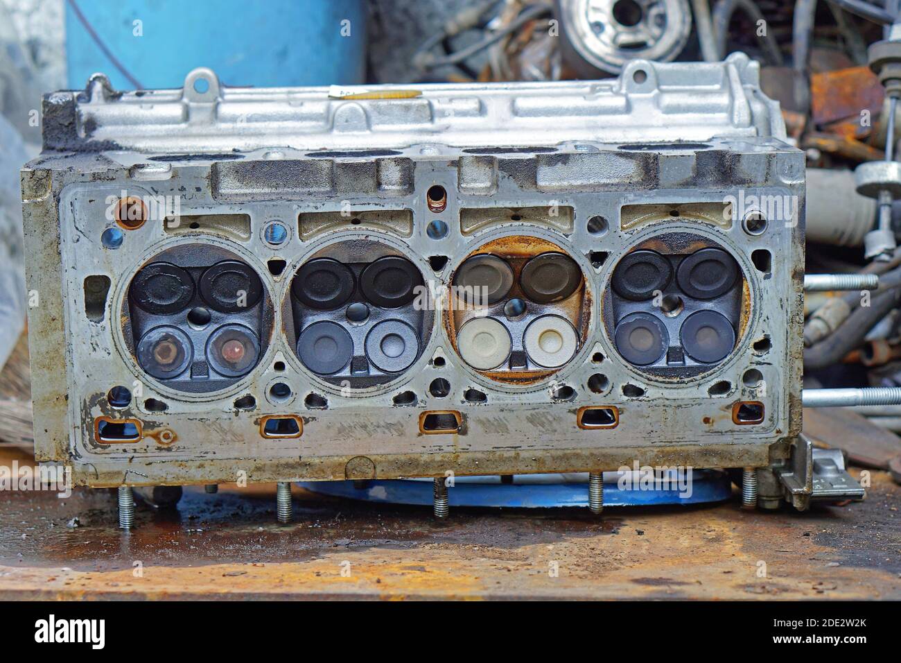 Open engine block at work bench in service garage repair shop Stock