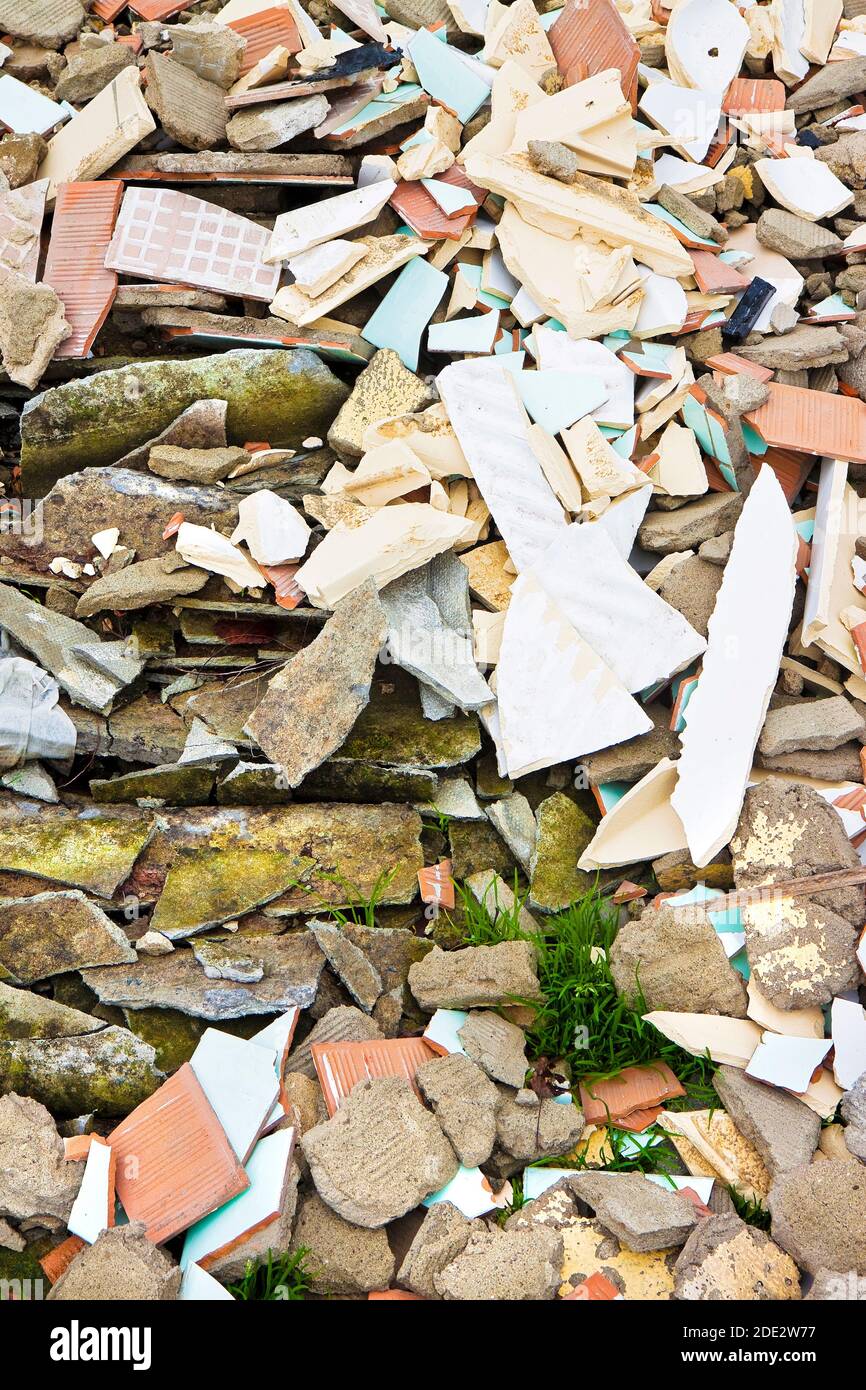 Debris after the demolition of a building with asbestos illegally abandoned on it Stock Photo
