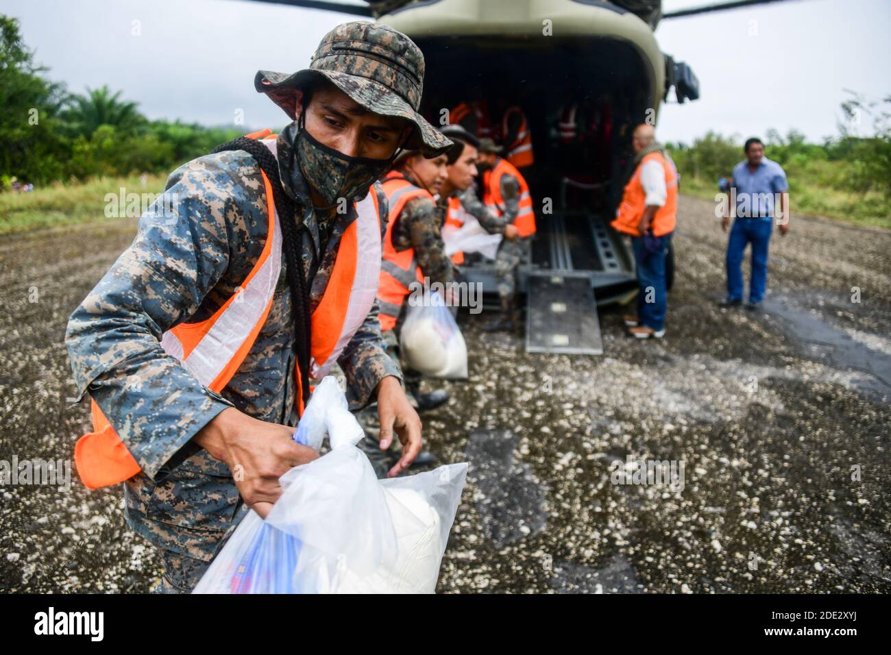 Guatemalan Armed Forces unload humanitarian aid from a U.S. Army CH-47 Chinook helicopter November 26, 2020 in Rubelsanto, Guatemala. Hurricane Iota swept through Central America destroying large sections of the coast and flooding roads. Stock Photo