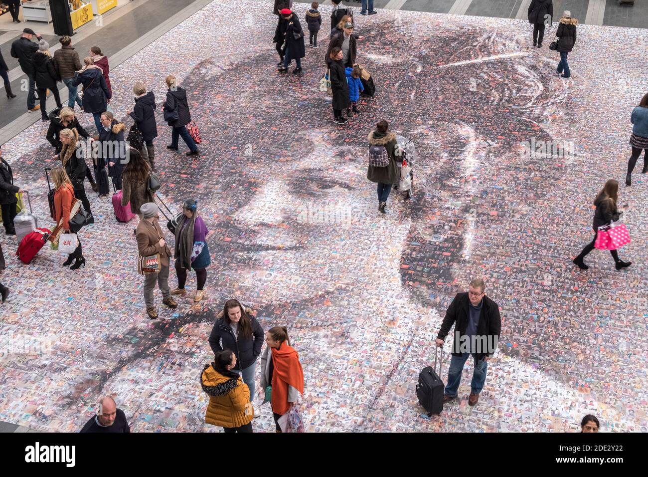 Photo mosaic artwork installation by Helen Marshall celebrating 100 years of women's suffrage. Birmingham New Street station, Birmingham, West Midlands Stock Photo