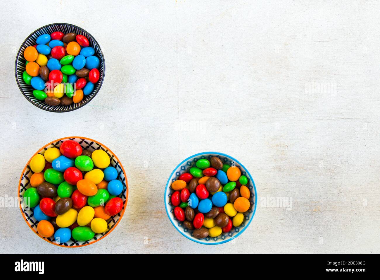 M&M's candy in the bowl on the white background, colorful candy texture ...