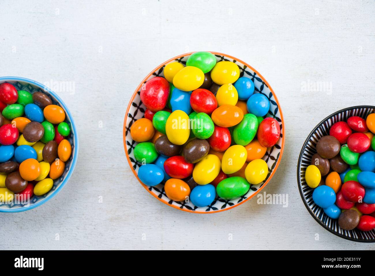 M&M's candy in the bowl on the white background, colorful candy texture ...
