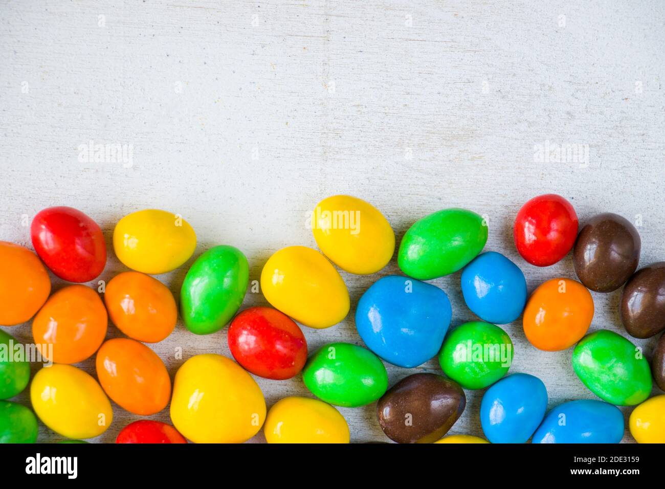 M&M's candy on the white background, colorful candy texture ...