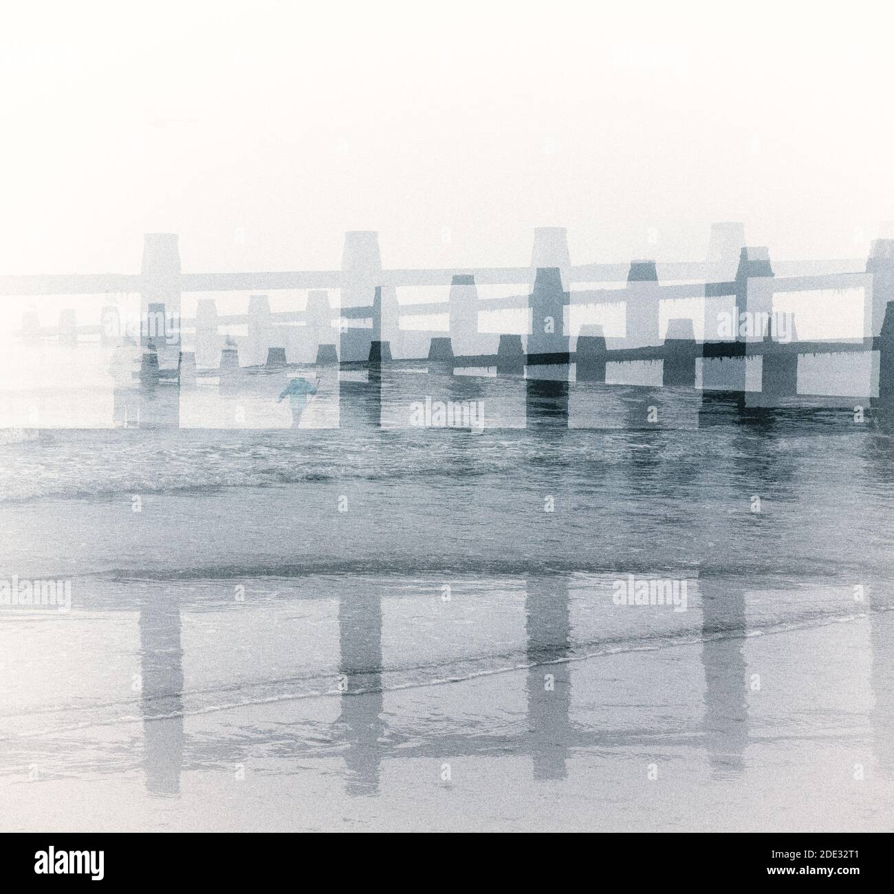 Creative, multiple exposure view of groins on the beach Stock Photo