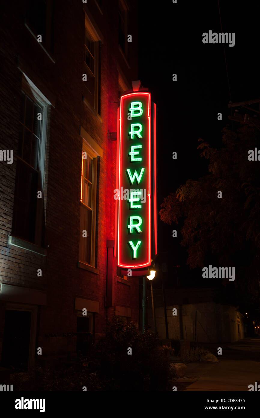 Neon brewery sign lights up the night. Stock Photo