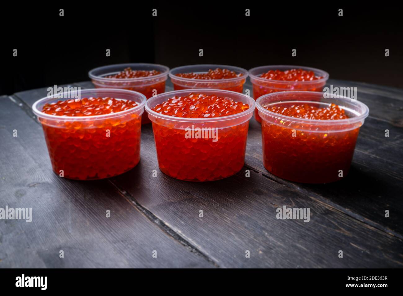 Pink salmon caviar and chum salmon caviar in plastic containers