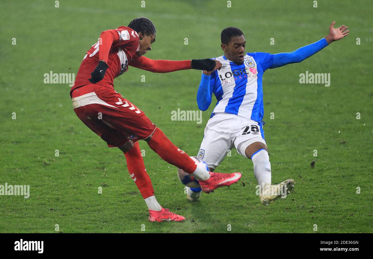 Middlesbrough's Djed Spence (left) and Huddersfield Town's Jaden Brown